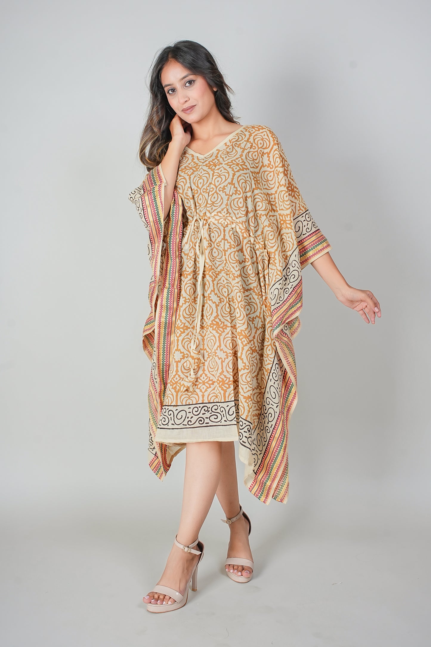 Girl wearing Hand Block Printed Cotton Kaftan Dress – Mustard Floral Jaal with Ethnic Borders