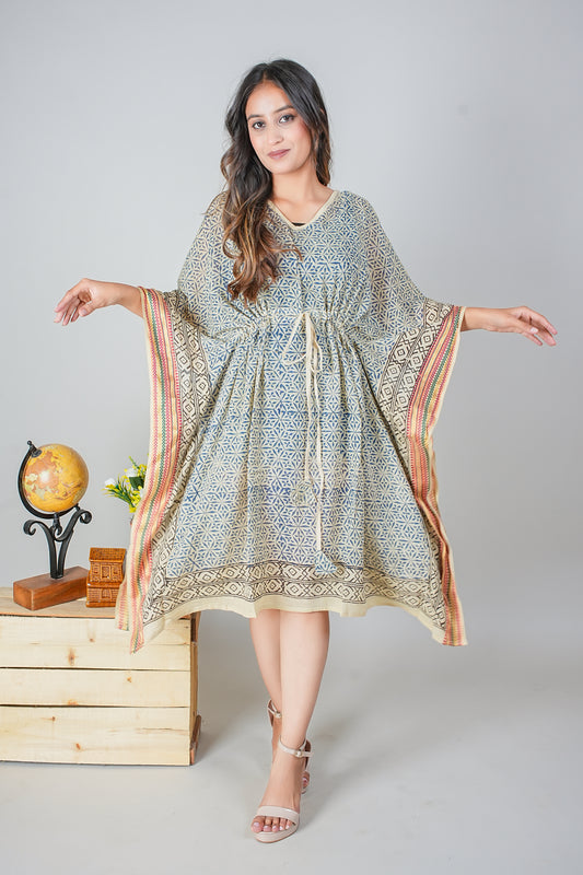 Woman wearing a patterned dress with a plain background